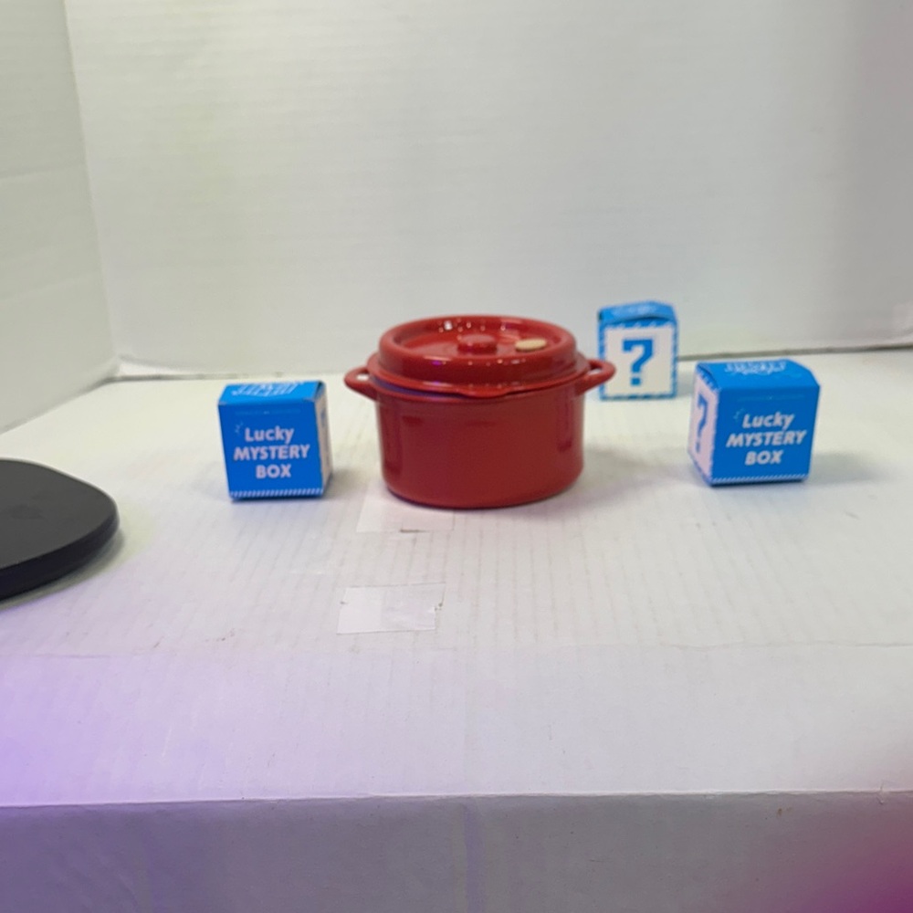 Red plastic Dutch oven. Microwavable